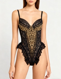 Detailed close-up of leopard print bodysuit with sheer black lace panels and slim straps
