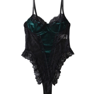 Green velvet bodysuit with black lace trim and adjustable thin straps on white background