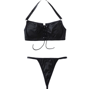 Sexy black two-piece bikini set with halter neck cross-straps and thong bottoms
