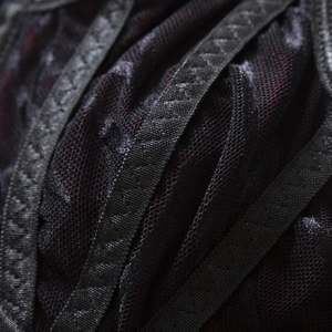 Macro shot of black gothic lace bra with transparent mesh and zigzag stitch detailing