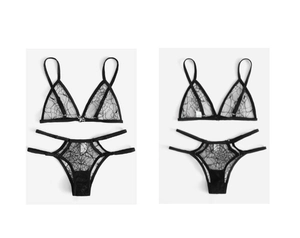 Macro detail of black lace lingerie set featuring spiderweb patterns and bat charms