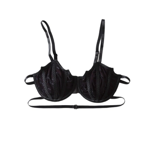 Gothic black lace bat-shaped bra with satin trim and sheer violet lining on white background