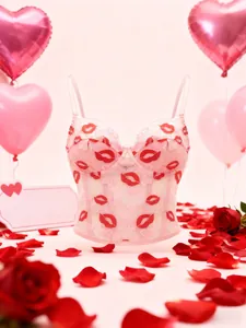 Detail of pink lace corset top with red lip prints and hearts for Valentine's Day