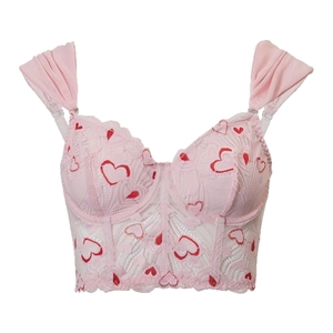 Pink lace bustier top with red heart embroidery and ruffled chiffon straps on white backdrop