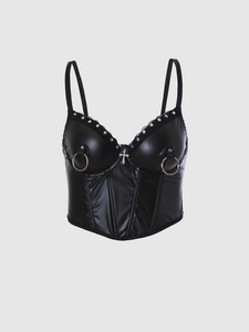 Close-up of black PU leather punk corset top with metal studs and cross pendant detail