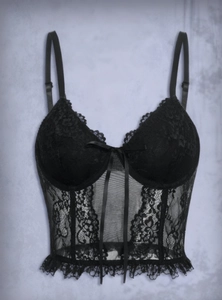 Detail of floral lace corset top featuring delicate mesh panels and bow decoration