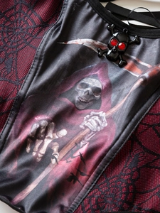 Gothic tank top detail featuring Grim Reaper print and skull charm with red crystals