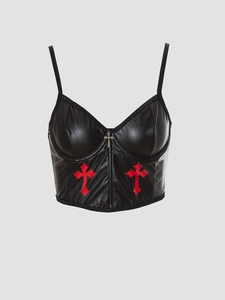 Detail of a black PU leather bustier with red Gothic crosses and a metal pendant