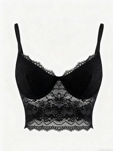 Close-up of black floral lace camisole with delicate eyelash lace trim and thin straps