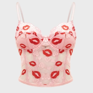 Pink lace bustier with red lip embroidery and heart patterns on sheer mesh fabric