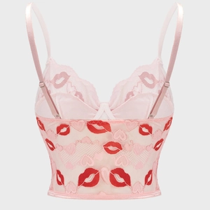 Pink lace bustier top with adjustable straps and red lip embroidery on mesh fabric