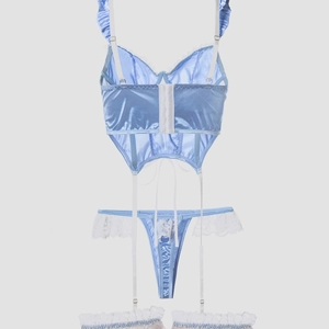 Three-piece light blue lace lingerie set with corset top, thong, and lace leg garter