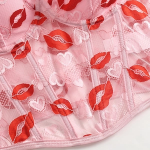 Sexy pink lace corset top with red lip prints and heart patterns featuring boning detail
