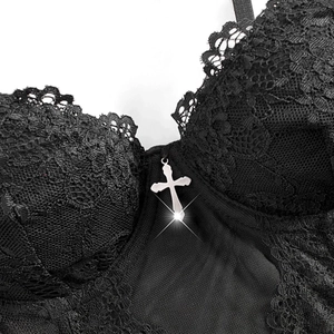 Dark lace corset top with fishbone structure and silver cross pendant on the chest