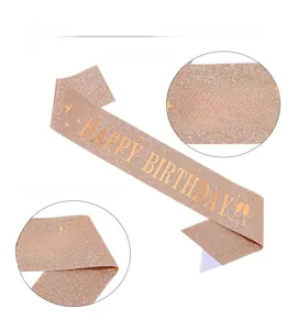 Detail of rose gold glitter birthday sash showing metallic gold Happy Birthday print