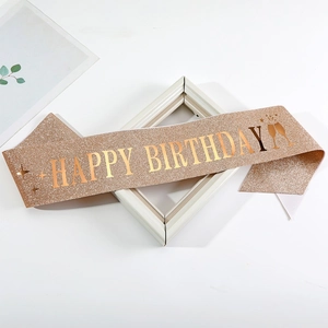 Rose gold glitter Happy Birthday sash with metallic gold lettering and party patterns