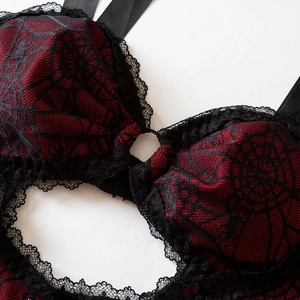Gothic spider web lace bodysuit in red and black with metallic ring detail