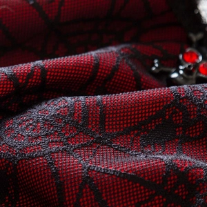 Gothic spider web lace bodysuit with red and black mesh and skull metallic hardware