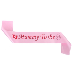 Pink satin Mommy To Be sash with red lettering and bear motif for baby shower events