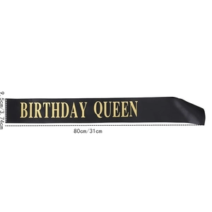 Detail view of the black satin Birthday Queen sash with dimensions 9.5cm by 80cm