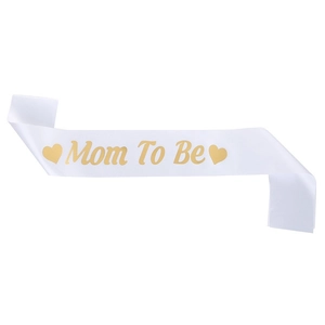 White satin Mom To Be sash with elegant gold foil lettering and hearts for baby shower