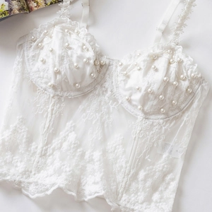 White floral lace corset top with delicate pearl embroidery and sheer boning details