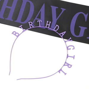 Detail of purple Birthday Girl headband and matching party sash with glittery lettering