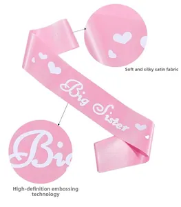 Detail of pink satin Big Sister sash showing smooth fabric texture and HD printing