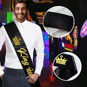 Detail view of black satin PROM KING sash with metallic gold crown and lettering