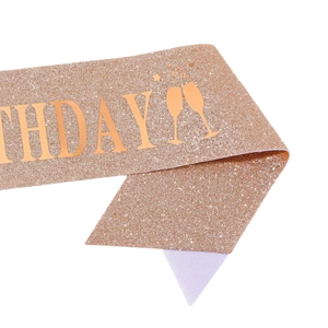 Glittery rose gold birthday sash with champagne glasses design and birthday text