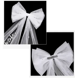 White bridal mesh bow hairclip with pearls and Bride to be lettering for weddings