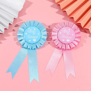 Pink and blue Big Sister rosette badges with satin ribbons for baby shower party props