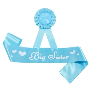 Detail of light blue satin Big Sister sash and pleated rosette badge for baby showers