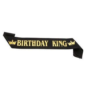 Black satin Birthday King sash with gold foil lettering and crown icons for men