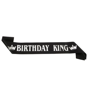 Black satin Birthday King sash with silver lettering and crown icons for men's parties