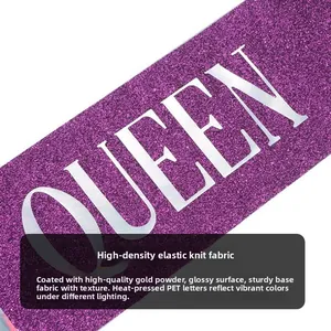 Detail of purple sequin sash with silver QUEEN text for birthday party decoration