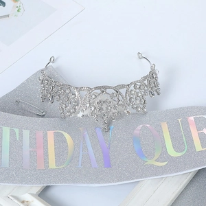 Detailed view of silver Birthday Queen sash with glitter finish and rhinestone crown