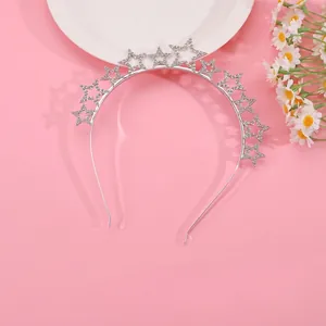 Silver star headband with sparkling crystals for elegant party styling on a pink base