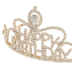 Close-up of golden birthday crown with Happy Birthday lettering and teardrop rhinestone