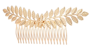 Detailed view of a golden leaf-shaped hair comb with 15 metal teeth for hairstyling
