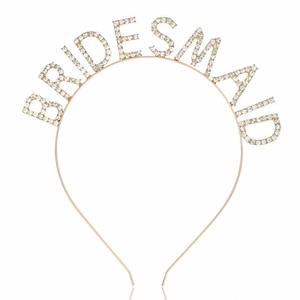 Close-up of golden BRIDESMAID headband with sparkling white rhinestones for weddings