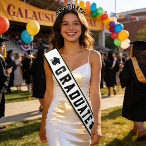 Close-up of a white satin Graduate sash and headband worn by a woman at a ceremony