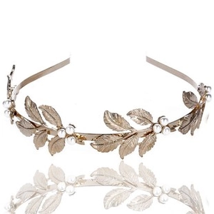 Detail of Greek goddess style golden leaf headband with white pearls and engraving