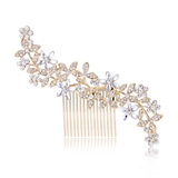 Detail of golden hair comb with leaf motifs, sparkling crystals and pearls for bridal wear