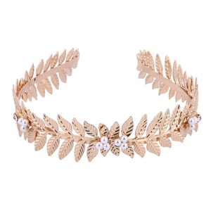 Golden bridal headband featuring leaf motifs and white pearls on a clean white background