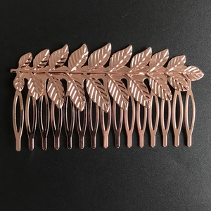Macro shot of rose gold metal leaf hair comb with detailed veins for wedding hairstyles