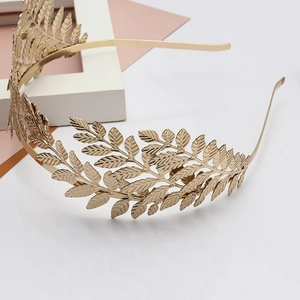 Elegant gold leaf crown bridal headband with intricate metallic foliage textures
