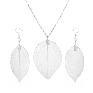 Detailed view of silver filigree leaf pendant necklace and matching drop earrings