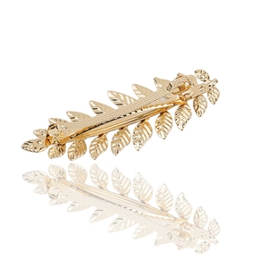 Elegant gold leaf spring hair clip in polished alloy metal on a clean white background