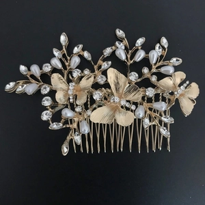Elegant gold leaf and butterfly hair comb with pearls and rhinestones for bridal hairstyle